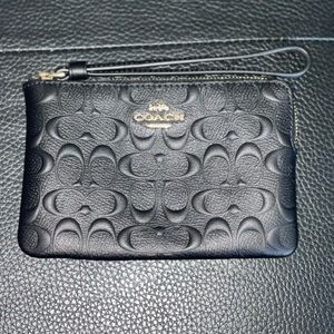 Black w/gold  brand new coach wristlet.